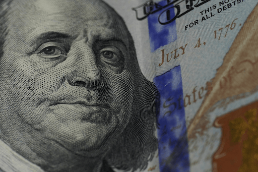 A close-up of the portrait on a US hundred-dollar bill